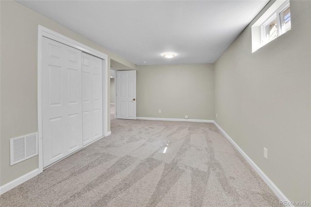 unfurnished bedroom featuring light colored carpet