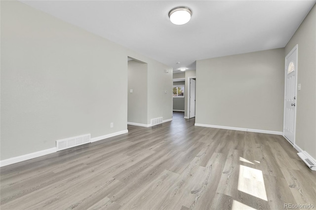 unfurnished room with light hardwood / wood-style flooring