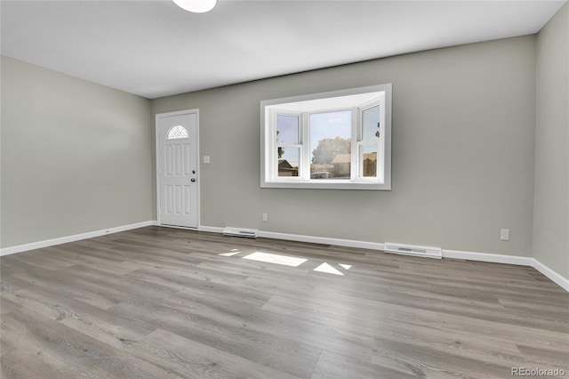 foyer with light wood-type flooring