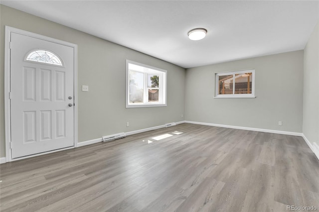 entryway with light hardwood / wood-style flooring