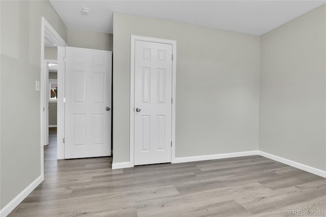 unfurnished bedroom with light hardwood / wood-style floors