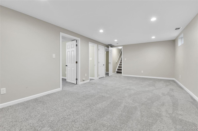 basement with light colored carpet