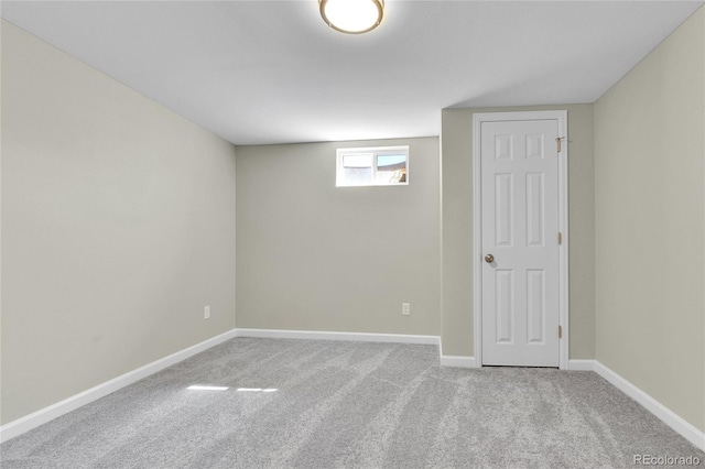 basement featuring light carpet