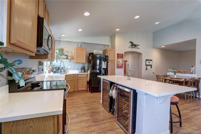 20194 Robins Dr, Denver, CO 80249 - kitchen with stainless steel appliances, beverage cooler, a sink, light wood finished floors, and recessed lighting