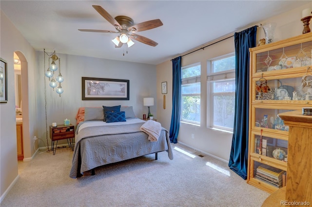 20194 Robins Dr, Denver, CO 80249 - carpeted bedroom featuring baseboards, arched walkways, and ceiling fan