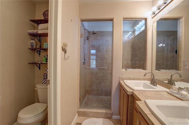 20194 Robins Dr, Denver, CO 80249 - full bathroom with a shower stall, double vanity, toilet, baseboards, and tile patterned floors