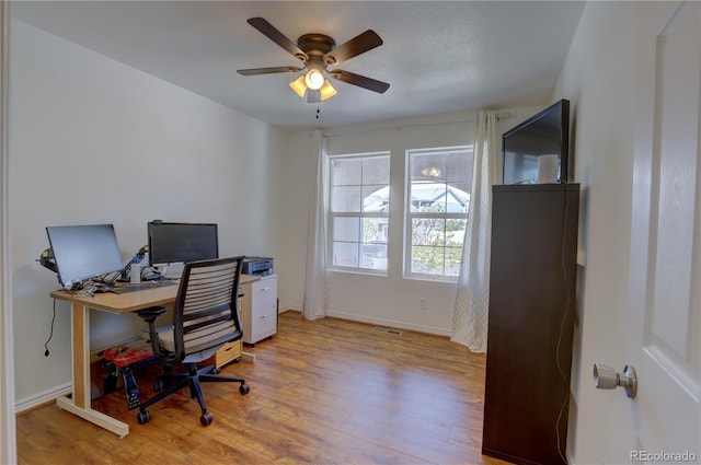 20194 Robins Dr, Denver, CO 80249 - home office featuring wood finished floors, ceiling fan, and baseboards