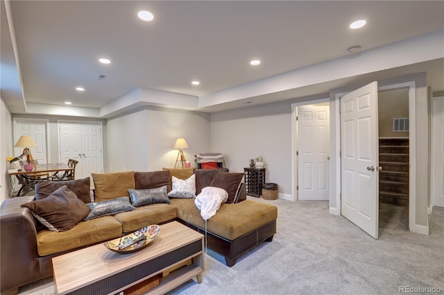 20194 Robins Dr, Denver, CO 80249 - living room featuring recessed lighting, light carpet, a tray ceiling, stairs, and baseboards