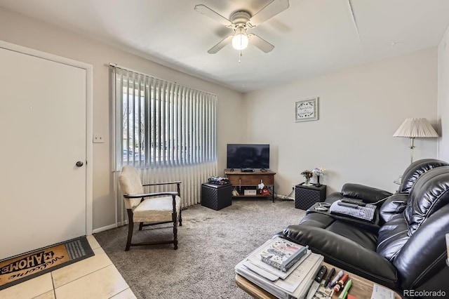 tiled living area with carpet floors and ceiling fan