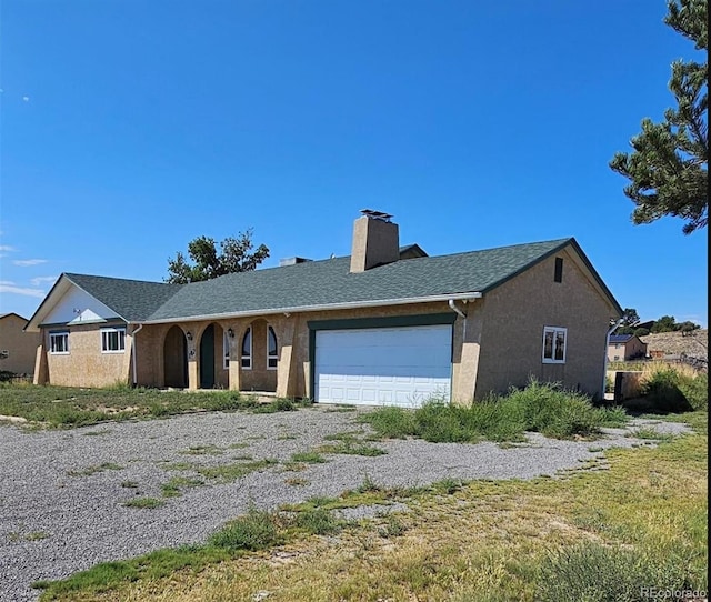 ranch-style house featuring a garage