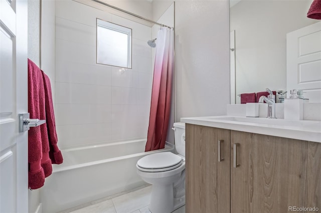 full bathroom featuring toilet, vanity, tile patterned floors, and shower / bath combo with shower curtain