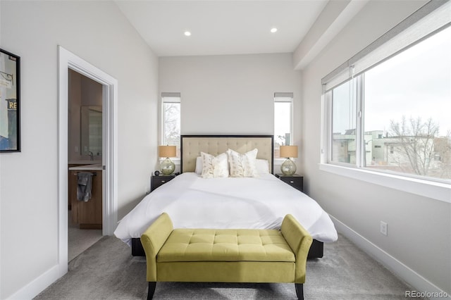 bedroom with carpet flooring and ensuite bath