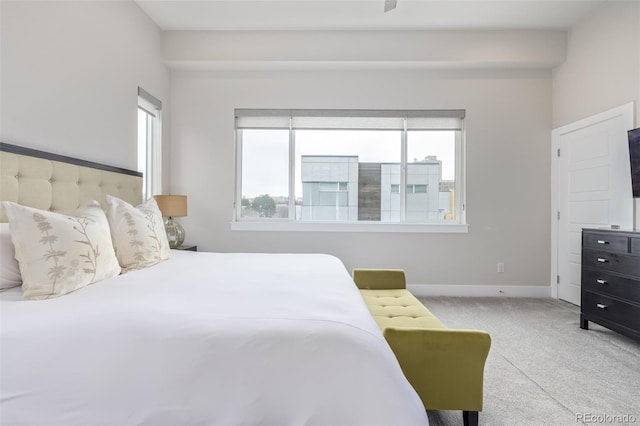 bedroom featuring light colored carpet