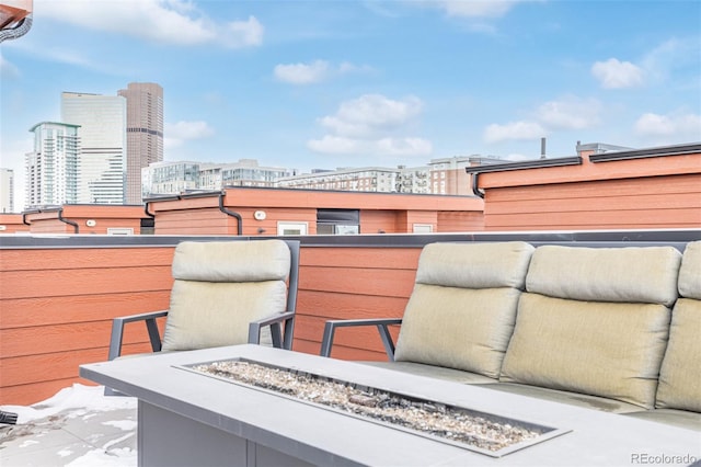 balcony featuring a fire pit