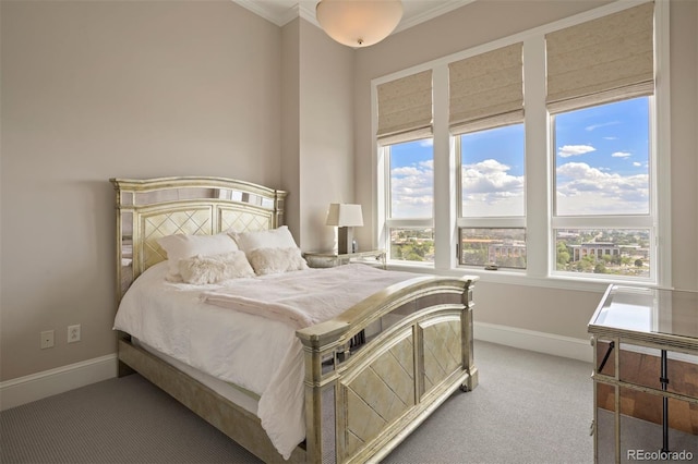 bedroom featuring ornamental molding and carpet floors