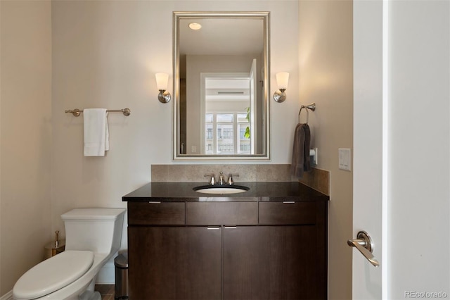 bathroom with vanity and toilet