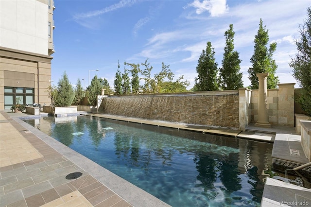 view of pool featuring a patio