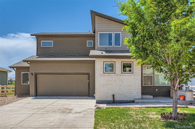 7263 Horsechestnut St, Wellington, CO 80549 - view of front of house featuring an attached garage, concrete driveway, and roof with shingles