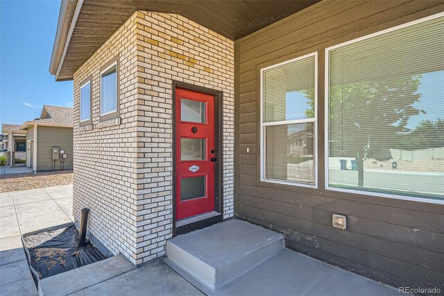 7263 Horsechestnut St, Wellington, CO 80549 - view of exterior entry featuring brick siding
