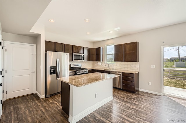 7263 Horsechestnut St, Wellington, CO 80549 - kitchen with appliances with stainless steel finishes, dark brown cabinetry, dark wood-style floors, baseboards, and recessed lighting