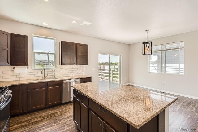 7263 Horsechestnut St, Wellington, CO 80549 - kitchen with a sink, appliances with stainless steel finishes, dark brown cabinetry, and recessed lighting