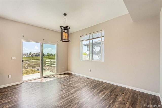 7263 Horsechestnut St, Wellington, CO 80549 - empty room with dark wood-style flooring and baseboards