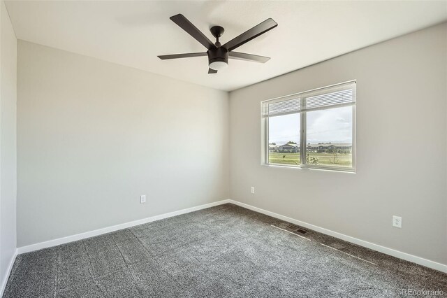 7263 Horsechestnut St, Wellington, CO 80549 - empty room featuring dark colored carpet, baseboards, and ceiling fan