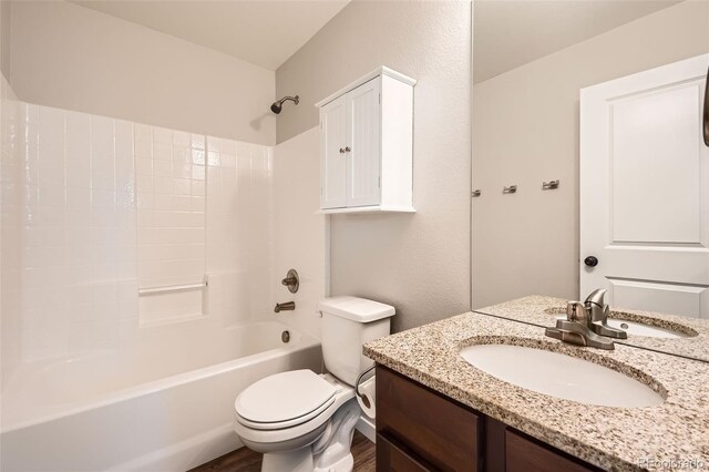 7263 Horsechestnut St, Wellington, CO 80549 - full bathroom with toilet, vanity,  shower combination, and wood finished floors