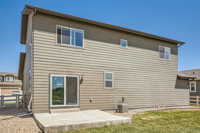 7263 Horsechestnut St, Wellington, CO 80549 - back of property with a patio and cooling unit