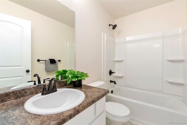 bathroom featuring toilet, bathing tub / shower combination, and vanity