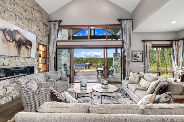 60 Barton Ridge Dr, Breckenridge, CO 80424 - living area featuring wood finished floors, high vaulted ceiling, and a fireplace