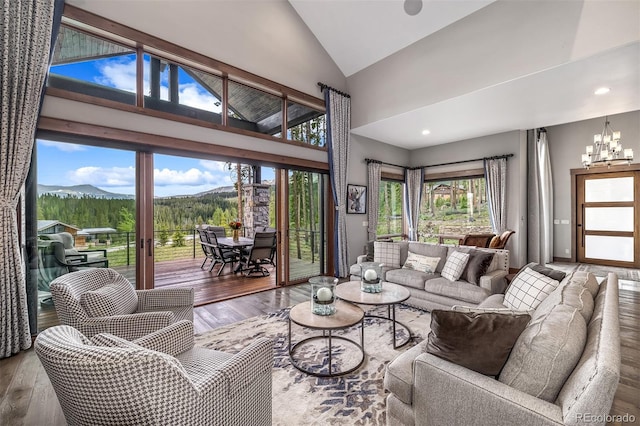 60 Barton Ridge Dr, Breckenridge, CO 80424 - living area featuring hardwood / wood-style flooring, a mountain view, a chandelier, high vaulted ceiling, and recessed lighting