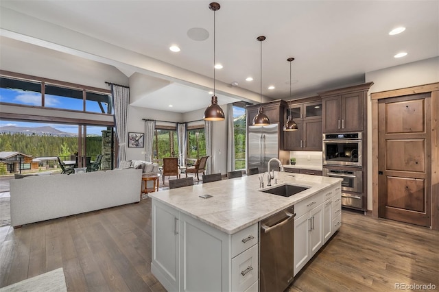60 Barton Ridge Dr, Breckenridge, CO 80424 - kitchen with open floor plan, appliances with stainless steel finishes, dark wood finished floors, glass insert cabinets, and recessed lighting