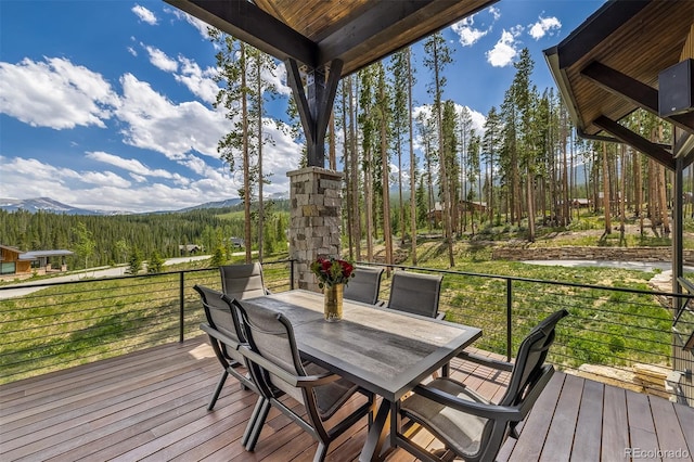 60 Barton Ridge Dr, Breckenridge, CO 80424 - deck featuring outdoor dining space, a wooded view, and a mountain view