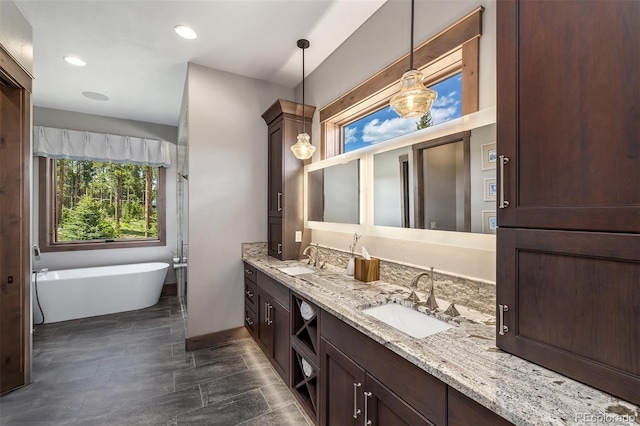 60 Barton Ridge Dr, Breckenridge, CO 80424 - full bathroom with double vanity, a freestanding bath, and recessed lighting