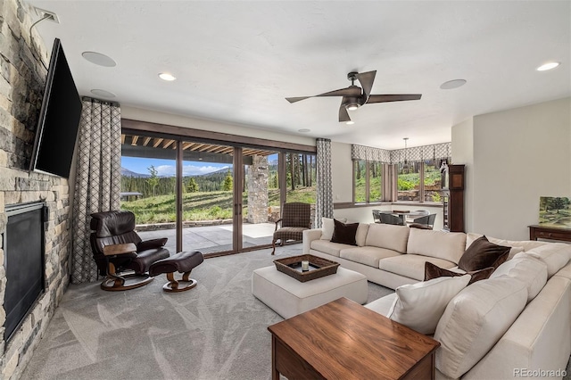 60 Barton Ridge Dr, Breckenridge, CO 80424 - living room with a stone fireplace, carpet, a ceiling fan, french doors, and recessed lighting