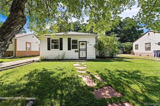 ranch-style house with a front lawn