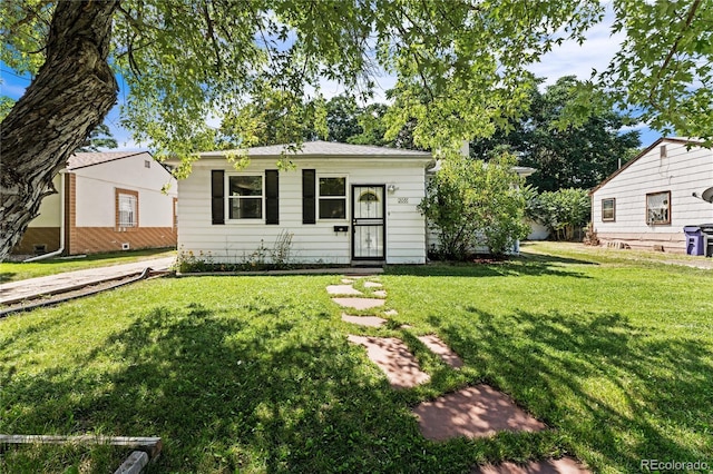 ranch-style house with a front lawn