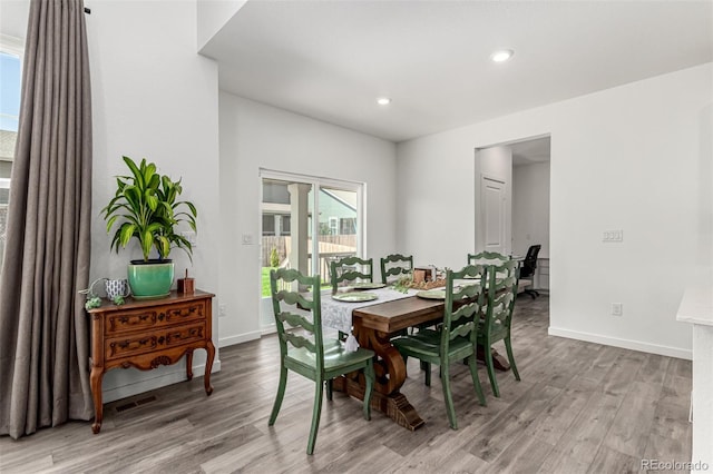 24326 E Ohio Dr, Aurora, CO 80018 - dining space with light wood finished floors, healthy amount of natural light, and recessed lighting