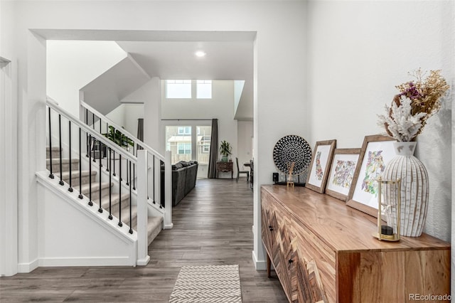 24326 E Ohio Dr, Aurora, CO 80018 - entryway featuring stairs, wood finished floors, and recessed lighting