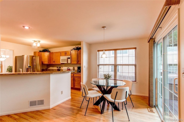 9614 W Powers Cir, Littleton, CO 80123 - dining room featuring light wood-style floors, a chandelier, and recessed lighting