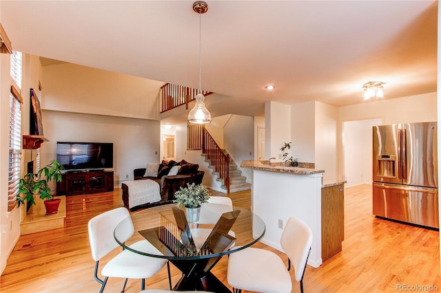 9614 W Powers Cir, Littleton, CO 80123 - dining room with stairs and light wood-style floors