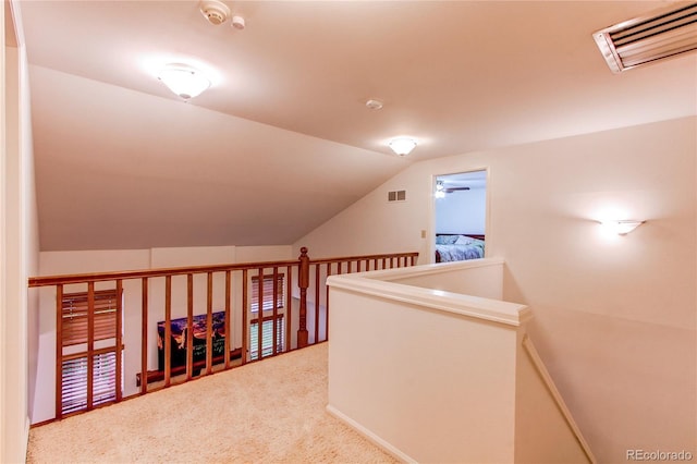 9614 W Powers Cir, Littleton, CO 80123 - hallway with vaulted ceiling, carpet flooring, and an upstairs landing