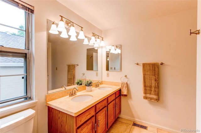 9614 W Powers Cir, Littleton, CO 80123 - full bath with double vanity and tile patterned floors