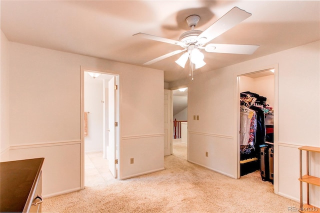 9614 W Powers Cir, Littleton, CO 80123 - unfurnished bedroom featuring carpet flooring, a walk in closet, a closet, a ceiling fan, and ensuite bath