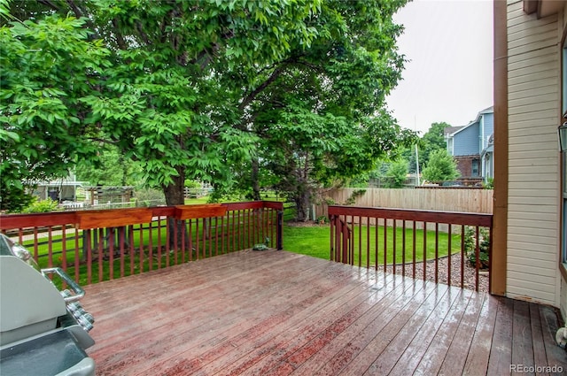 9614 W Powers Cir, Littleton, CO 80123 - wooden terrace with a fenced backyard