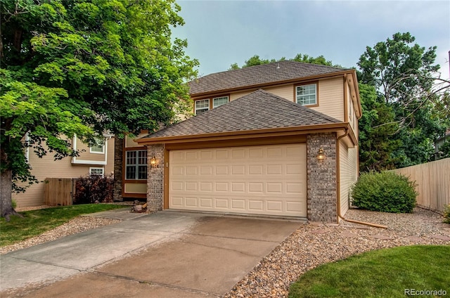 9614 W Powers Cir, Littleton, CO 80123 - traditional-style home with driveway, an attached garage, brick siding, and a shingled roof