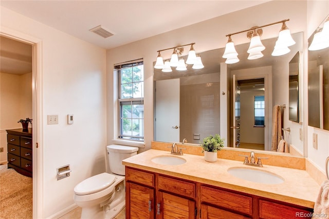 9614 W Powers Cir, Littleton, CO 80123 - bathroom with double vanity and toilet