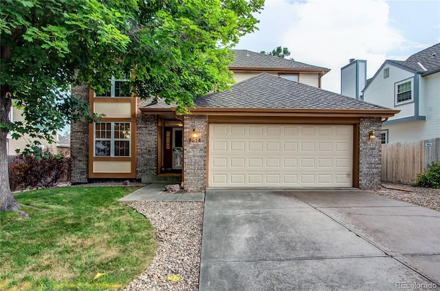 9614 W Powers Cir, Littleton, CO 80123 - view of front of home featuring driveway, a garage, and brick siding