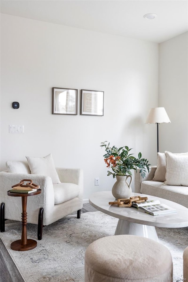 living room with baseboards and wood finished floors